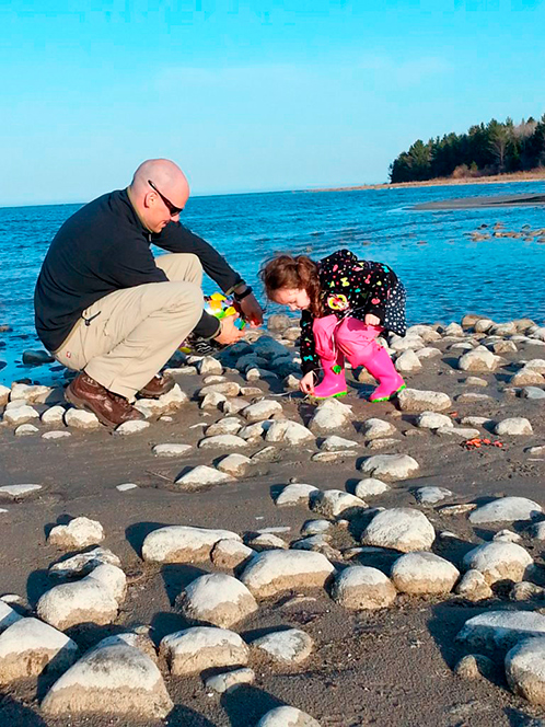 Man and child at beach