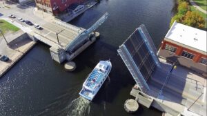 The Lady Michigan glass bottom boat sails under the 2nd Avenue bridge out into Lake Huron