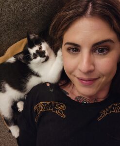 Nicole with her newest black and white tuxedo kitten, Sgt. Pepper